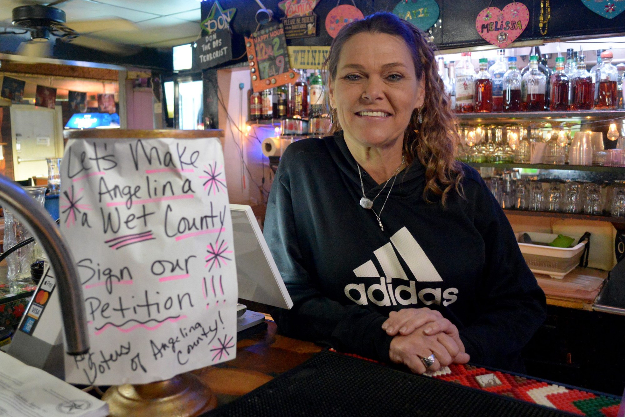 Katie Self, manager of The Country Club, is gathering signatures to petition changing Angelina County to a wet county to expand liquor sales.