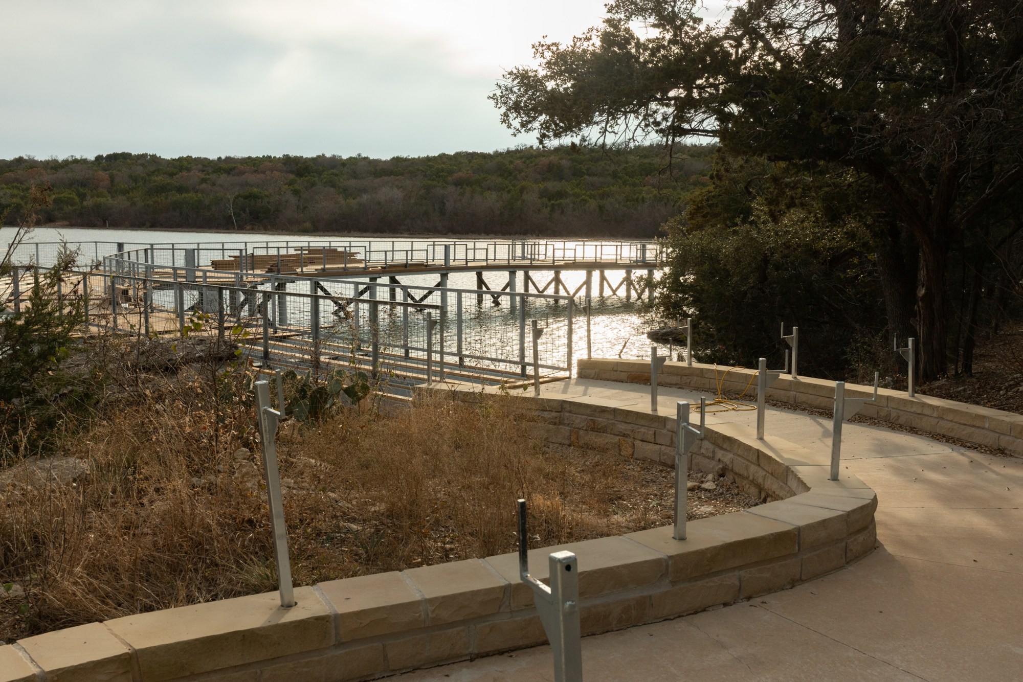 A boardwalk under construction offers a view of Tucker Lake at Palo Pinto Mountains State Park.