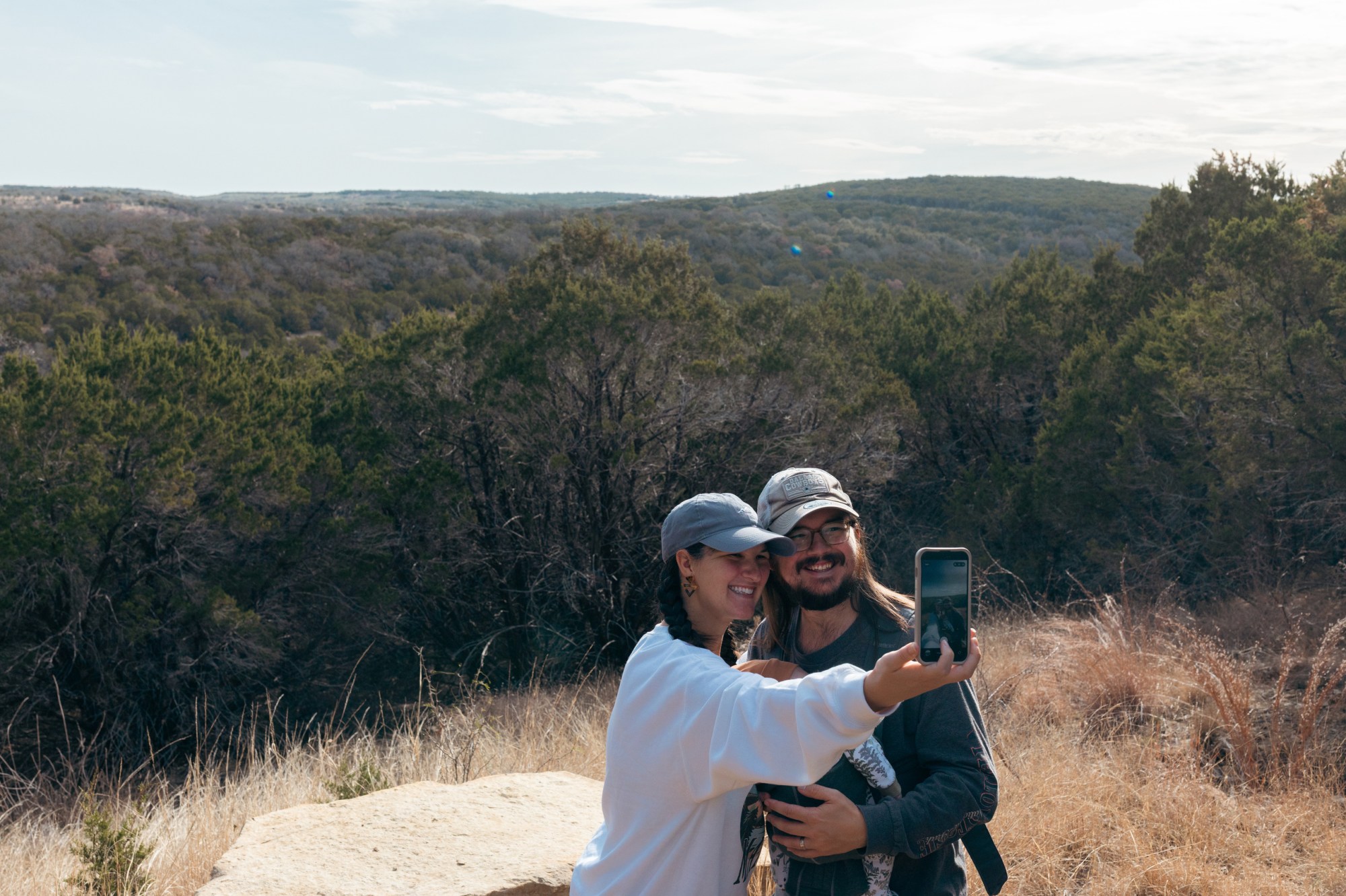 McKenna and Jacob Hamm hold their 6-week-old son at a scenic overlook at the park during a guided hike on Jan. 1, 2026.