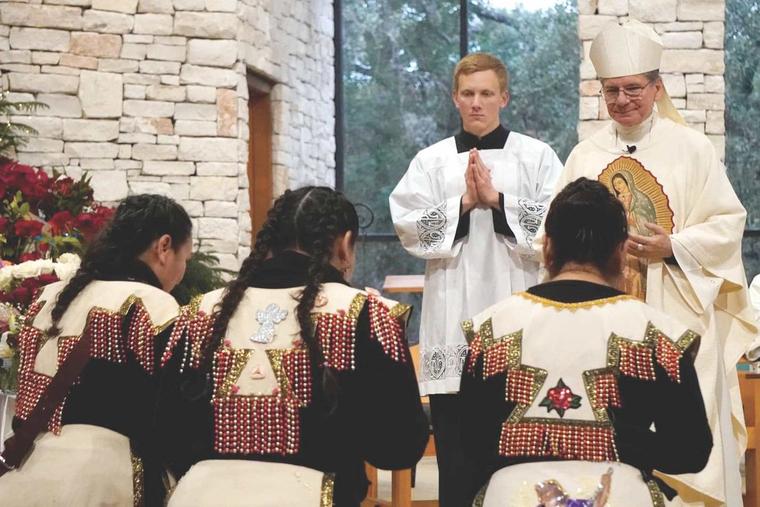 Archbishop Gustavo García-Siller of San Antonio blesses matachine dancers during a celebration on the feast of Our Lady of Guadalupe. He said he believes that Hispanics, immigrants especially, will help bring new life into the Church.