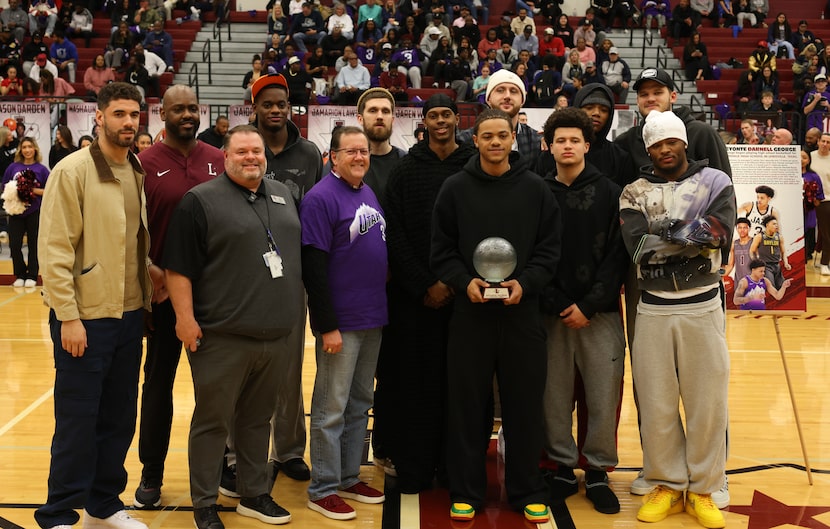 Utah Jazz guard Keyonte George, 3rd from right in front, is joined by Jazz teammates and...