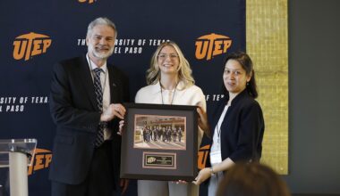 John Wiebe, Ph.D. (left), UTEP provost and vice president for academic affairs, and Monika Akbar, Ph.D. (right), faculty lead and director of the Miners Cybersecurity Clinic, presented a framed photo of the clinic’s inaugural cohort to Paige Godvin (center), a security consultant for Google, during a press conference on Jan. 30, 2026, on the UTEP campus to celebrate the completion of the clinic’s first full operational cycle. The Miners Cybersecurity Clinic was established in 2024 through $1 million in funding from Google’s Cybersecurity Clinics Fund.