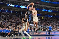 Dallas Mavericks forward Cooper Flagg (32) comes down with a rebound against Golden State...