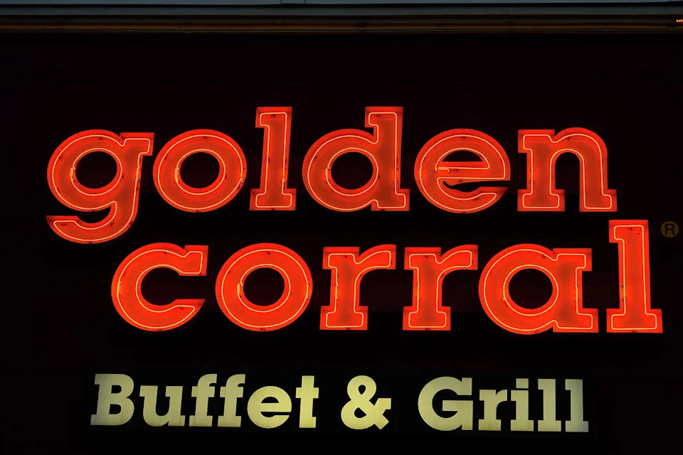 A neon sign at Golden Corral in Beaumont. (Ryan Pelham/The Enterprise)