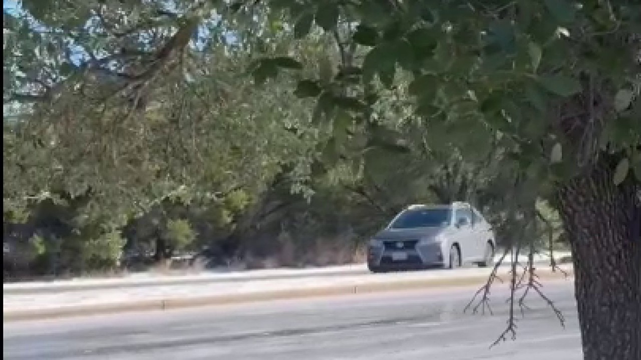Caught on camera: Car slides down icy Austin road