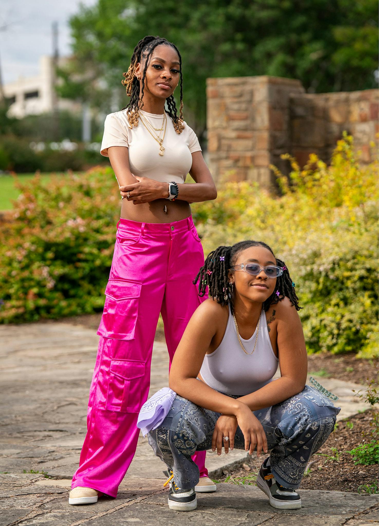 May 10 5:35 P.M. Jazé Rowe, 29, (left) and Autii Tennyson, 24, pose for a portrait before filming a hip hop music video for a song by Tennyson, who releases music under the name Autii, called “Seasons (feat. Jazé)” at Lake Cliff Park. Rowe is from East Texas and Tennyson from Oak Cliff. “It’s home to me,” Tennyson said of her neighborhood. “It’s where I grew up at. It’s all I know, so it makes me comfortable.”