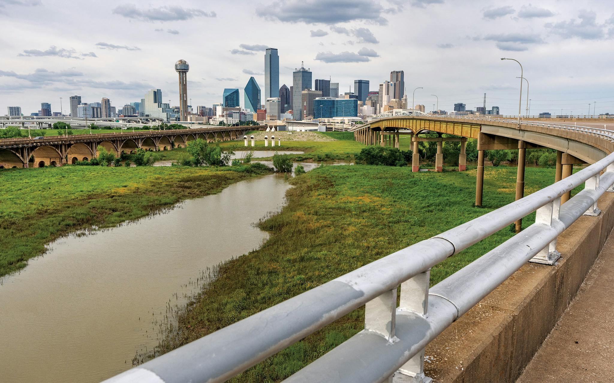 May 10 6 P.M. The skyline rising behind the Trinity River floodplain as seen from the Jefferson Boulevard Viaduct.