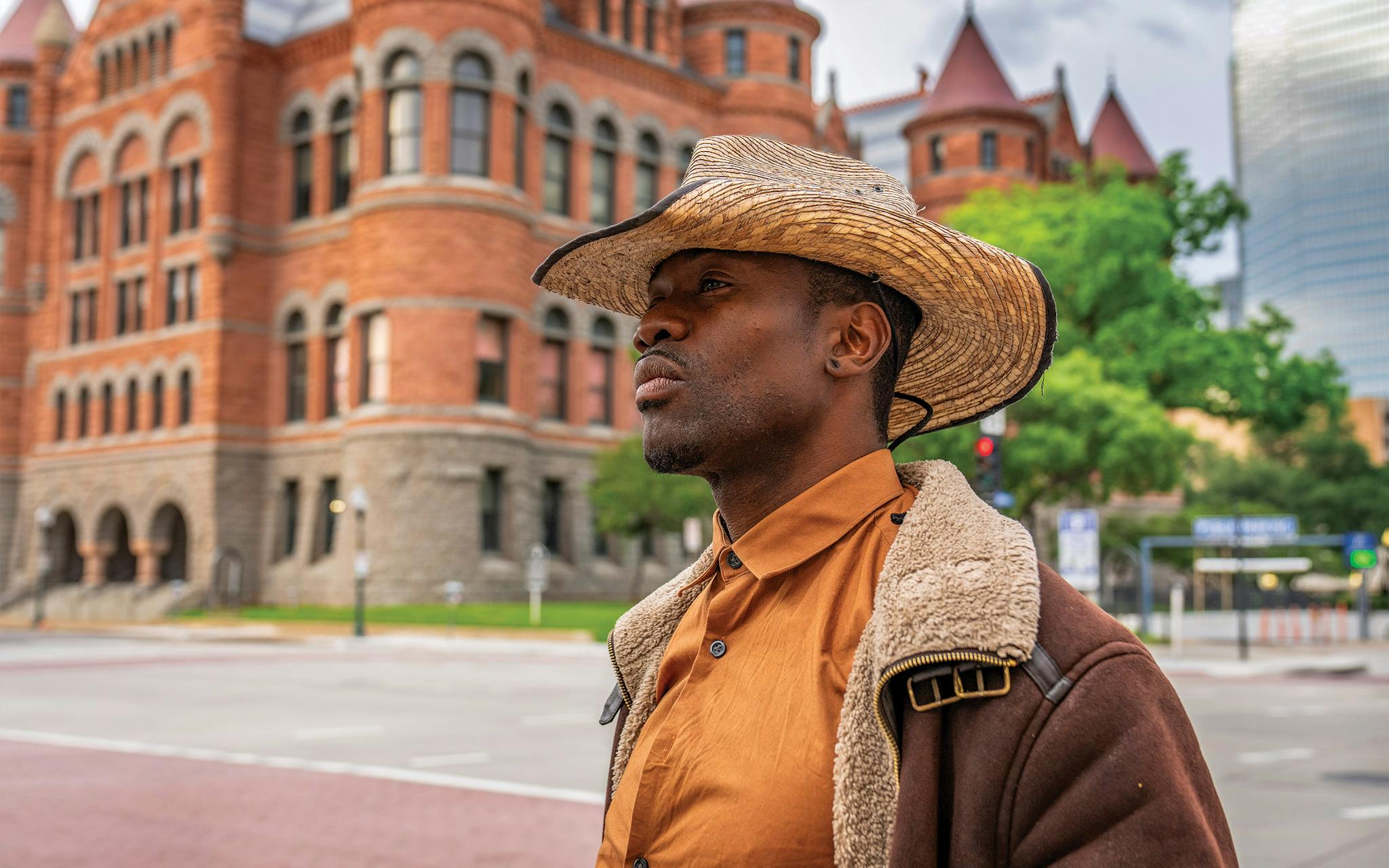 May 10 7:06 P.M. Darryl Williams, 36, stands at the intersection of Commerce and South Houston Streets outside the Old Red Museum of Dallas County History & Culture in Dealey Plaza. Williams was living in a tent under one of the concrete pergolas nearby.