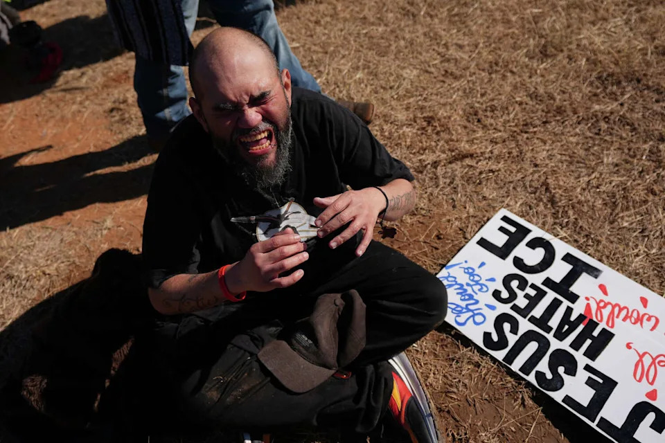 A protester reacts to the effects of pepper spray launched by Texas troopers to disperse protesters outside the South Texas Family Residential Center detention facility where Liam Ramos and his father are being detained in Dilley, Texas, Wednesday, Jan. 28, 2026. (AP Photo/Eric Gay) (Eric Gay/AP)
