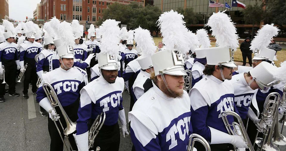 The TCU band gathers at the start of the All-Western Parade in downtown Fort Worth on Saturday.
