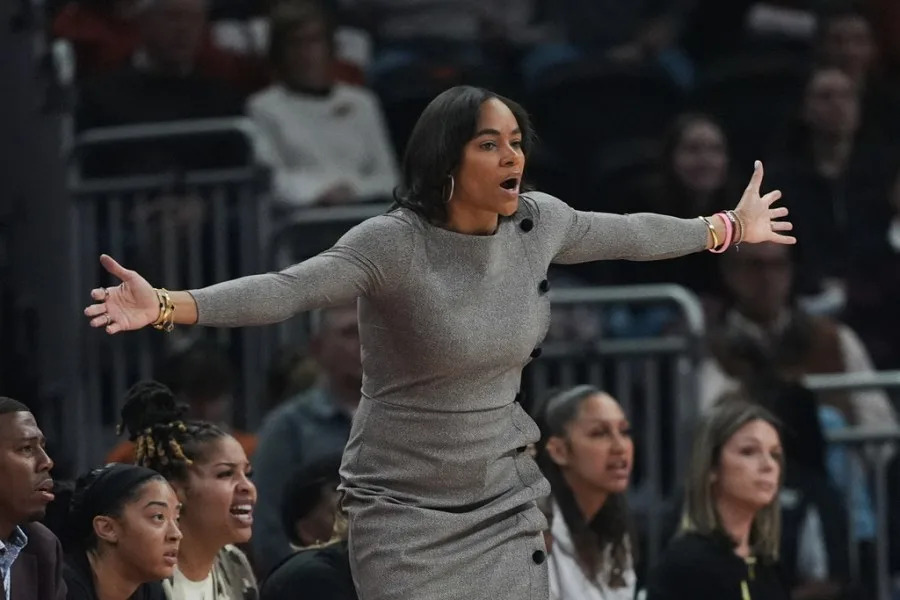 Texas A&M head coach Joni Taylor talks to her players during the first half of an NCAA college basketball game against Texas in Austin, Texas, Sunday, Jan. 18, 2026. (AP Photo/Eric Gay)