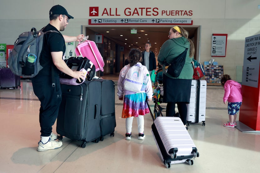 The Winston family heads to the car after  retrieving their luggage as the Southwest...