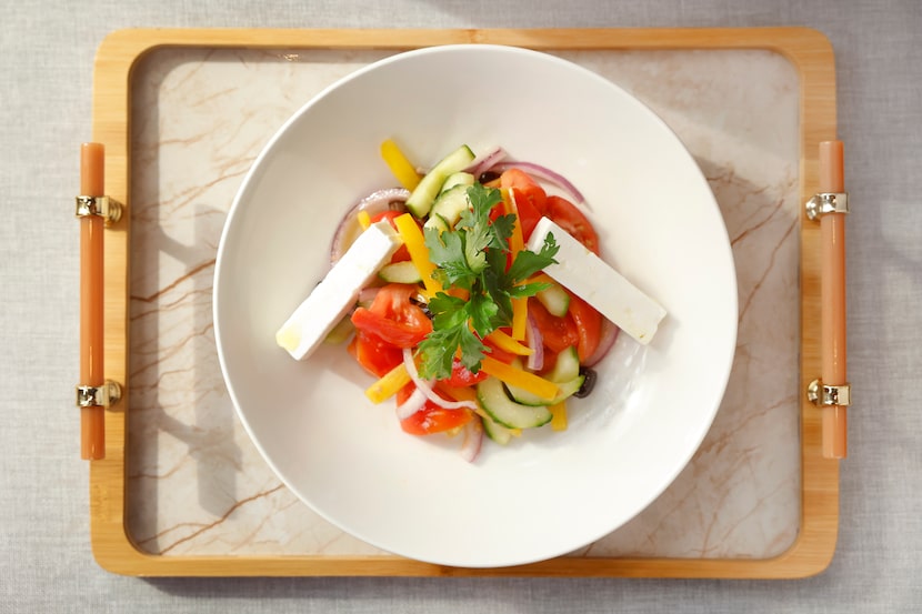 Mediterranean salad is a mix of tomatoes, cucumbers, bell peppers, onion and feta at Urban...