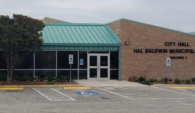 The city hall of Schertz, Texas is seen from the exterior on a cloudy day.