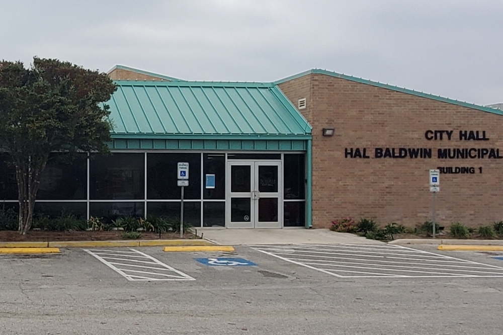 The city hall of Schertz, Texas is seen from the exterior on a cloudy day.
