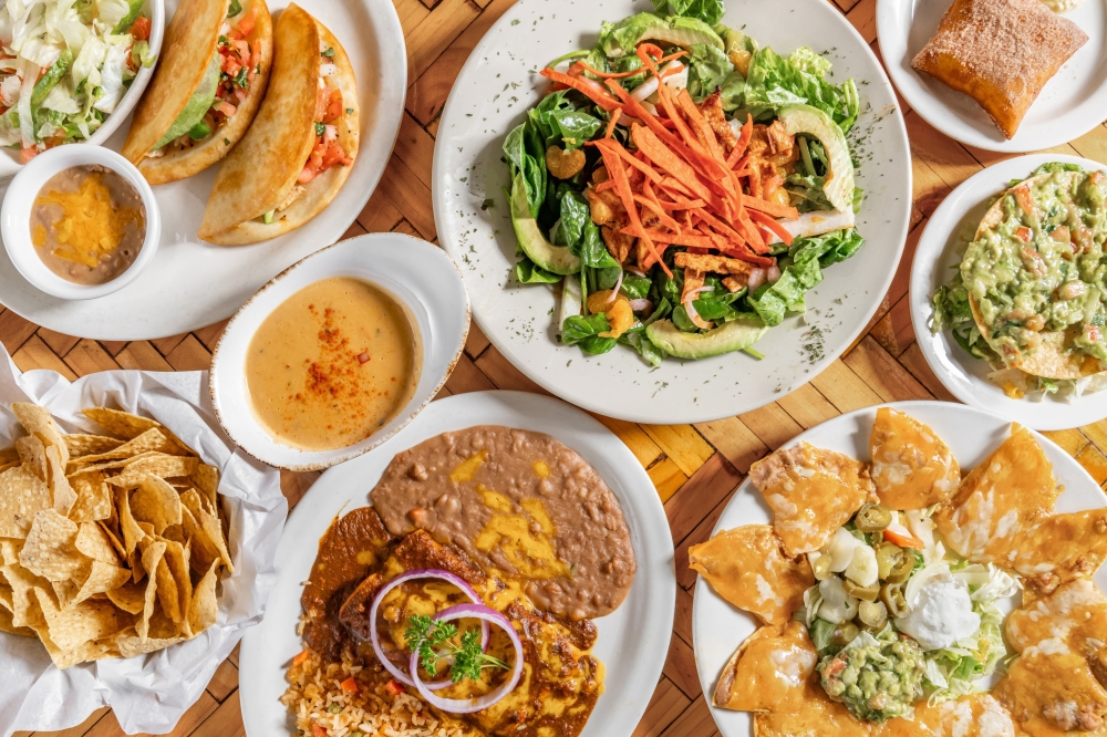 A bird's eye view of platters of Mexican food