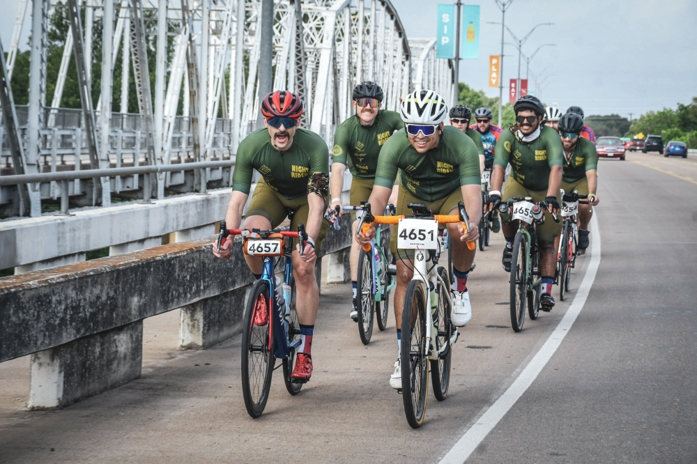 Participants in a past MS 150 ride across the Loop 150 bridge in Bastrop. (Courtesy National MS Society)