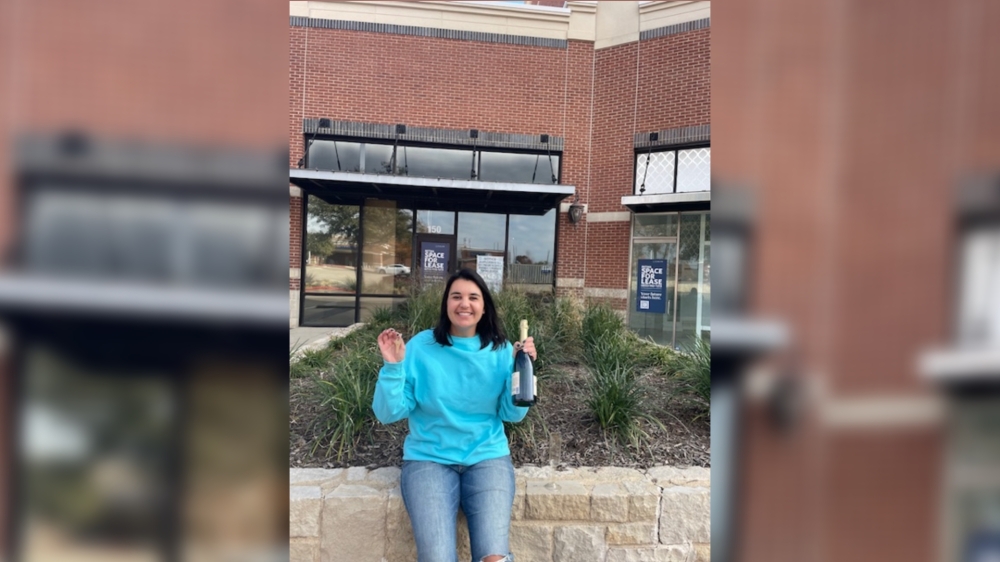 Owner Jessica Glenn stands in front of her new business location.