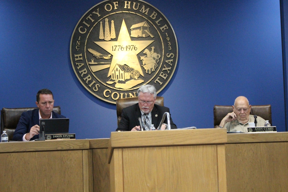 Pictured during an October 2024 Council meeting is City Manager Jason Stuebe, left, Mayor Norman Funderburk, center, and council member Andy Curry, right.