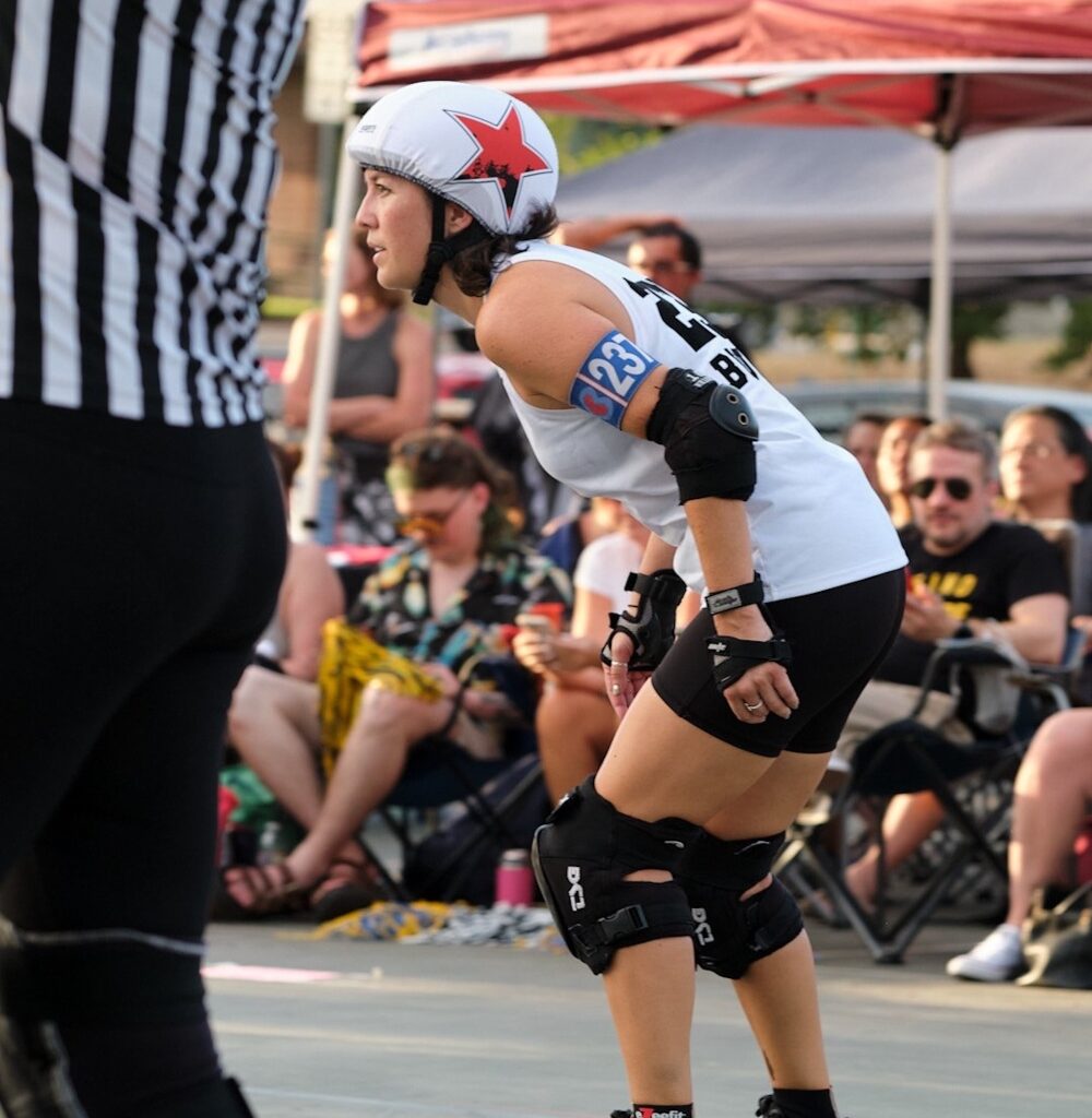 In a match, one player from each team wears a star helmet which makes their position as the jammer known. (Courtesy Texas Rollergirls/Photo by Maria Zoller)