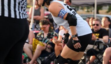 In a match, one player from each team wears a star helmet which makes their position as the jammer known. (Courtesy Texas Rollergirls/Photo by Maria Zoller)