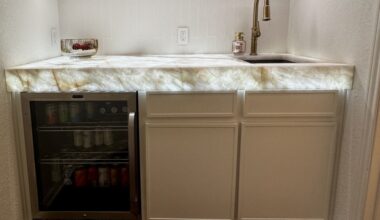 A kitchen counter with specialized lighting