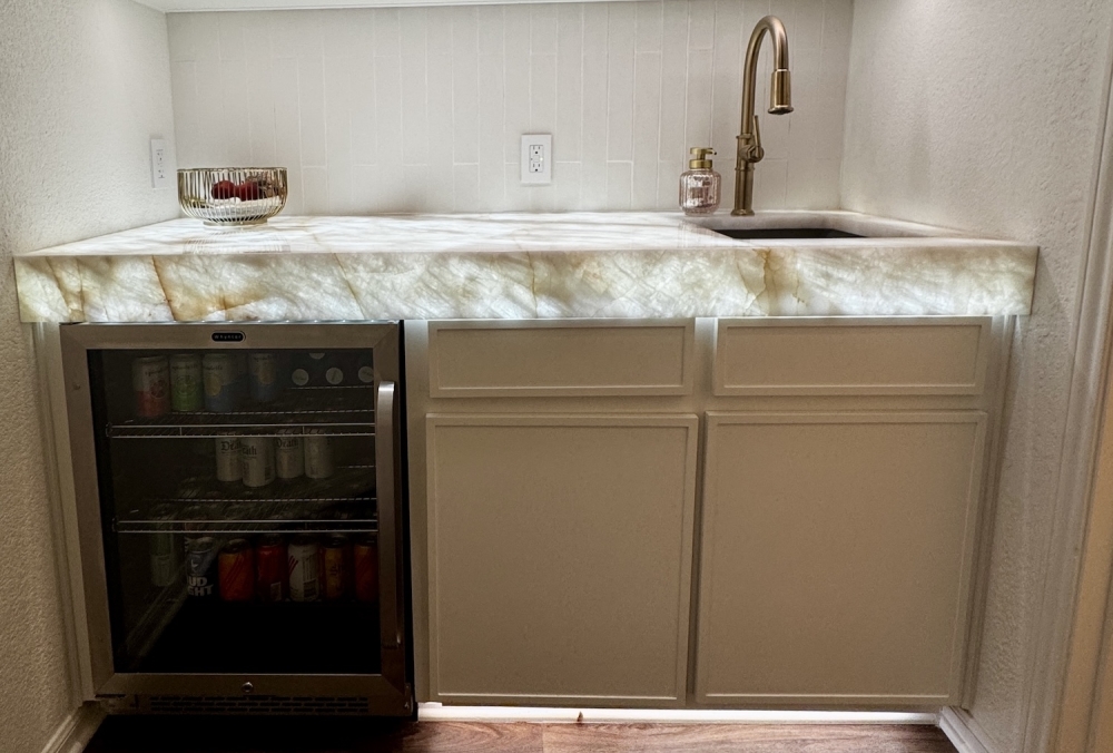 A kitchen counter with specialized lighting