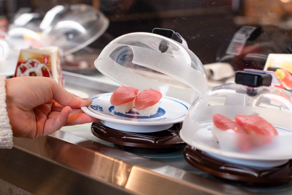 Dishes at Kura Revolving Sushi Bar are served on a revolving conveyor belt. (Courtesy Kura Revolving Sushi Bar)