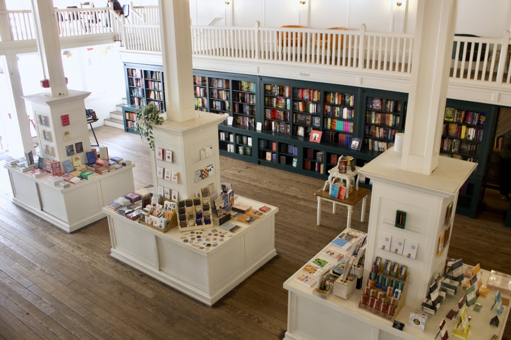 the inside of a bookstore from the second floor