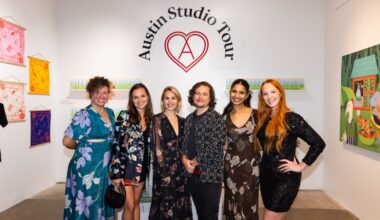 A group of Almost Real Things employees pose for a photo at an art studio