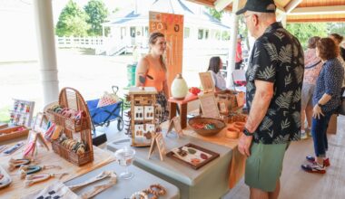 Woman and man talking at Allen cottage market