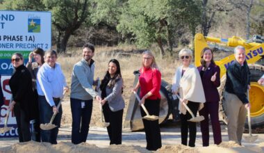 City, county and state officials turn dirt at a groundbreaking event