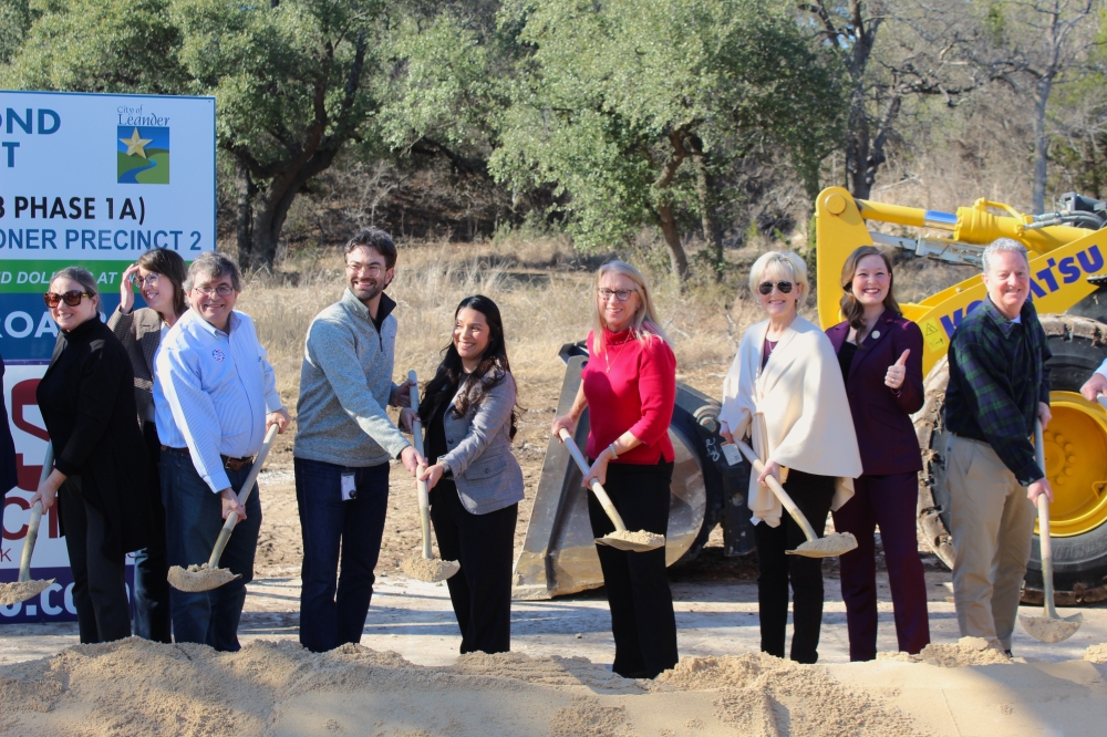 City, county and state officials turn dirt at a groundbreaking event