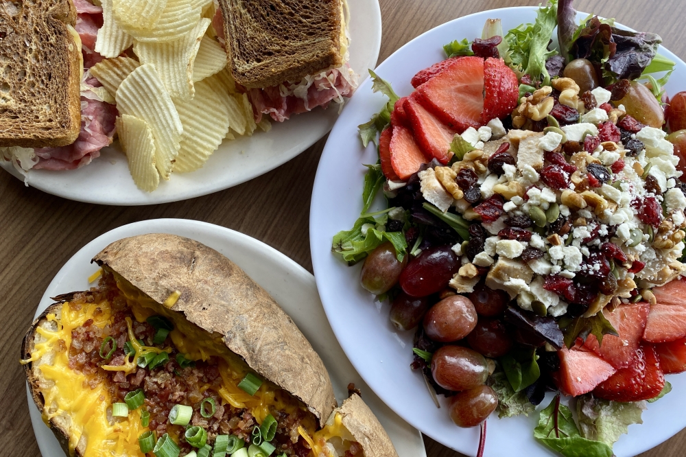 Popular menu items at Jasons Deli include The Plain Jane Potato ($11.19), a baked potato served with shredded cheddar, bacon bits, butter, green onion and sour cream. (Katlynn Fox/Community Impact)