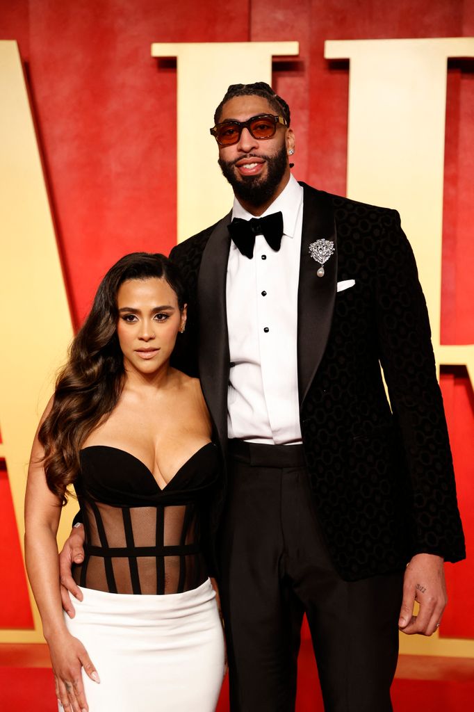 Marlen Davis (L) and US basketball player Anthony Davis attend the Vanity Fair Oscars Party at the Wallis Annenberg Center for the Performing Arts in Beverly Hills, California, on March 10, 2024. (Photo by Michael TRAN / AFP) (Photo by MICHAEL TRAN/AFP via Getty Images)