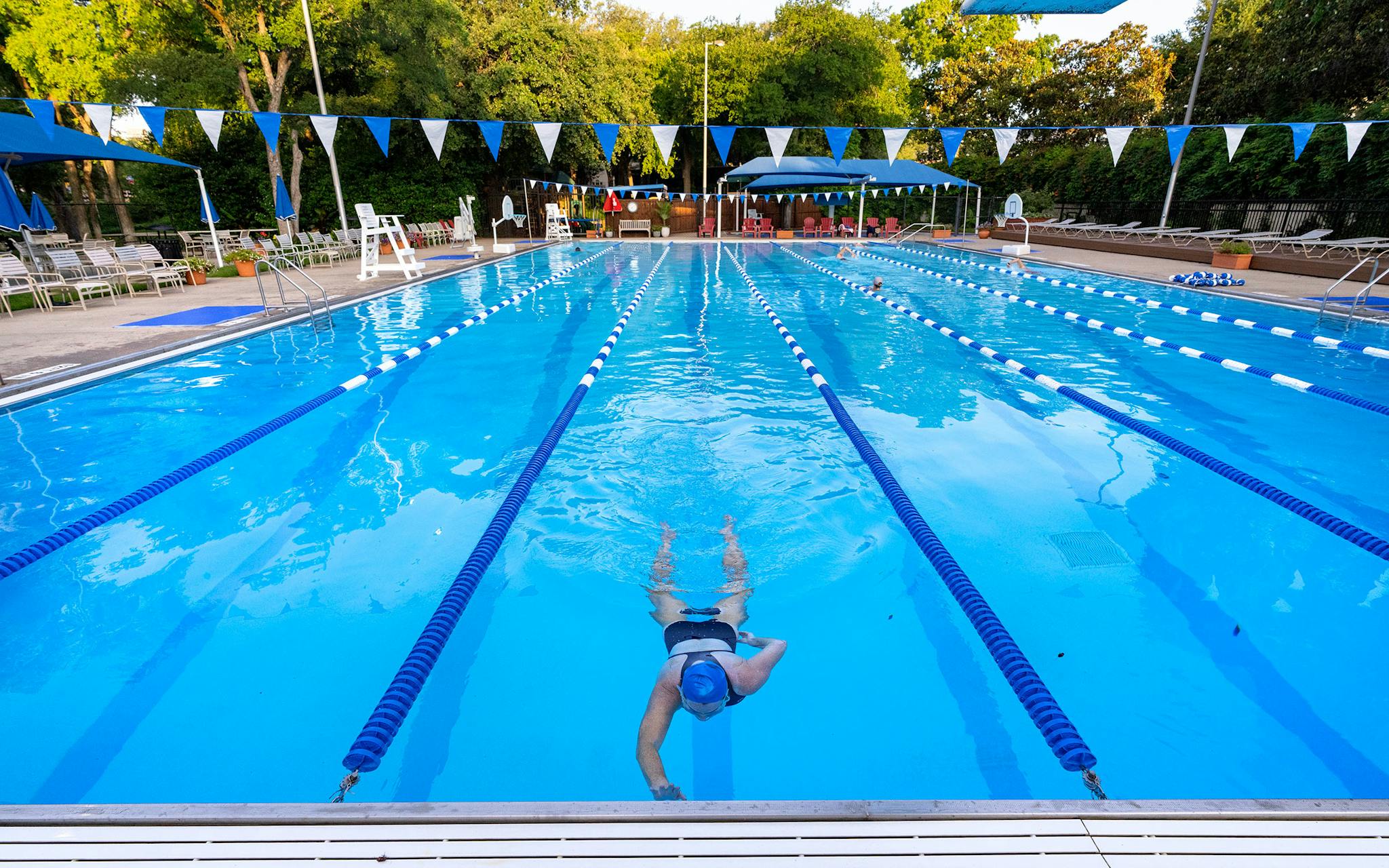 May 31 7:07 A.M. Jean Streepey, 61, swims some morning laps at Highland Park Swimming Pool in Davis Park.