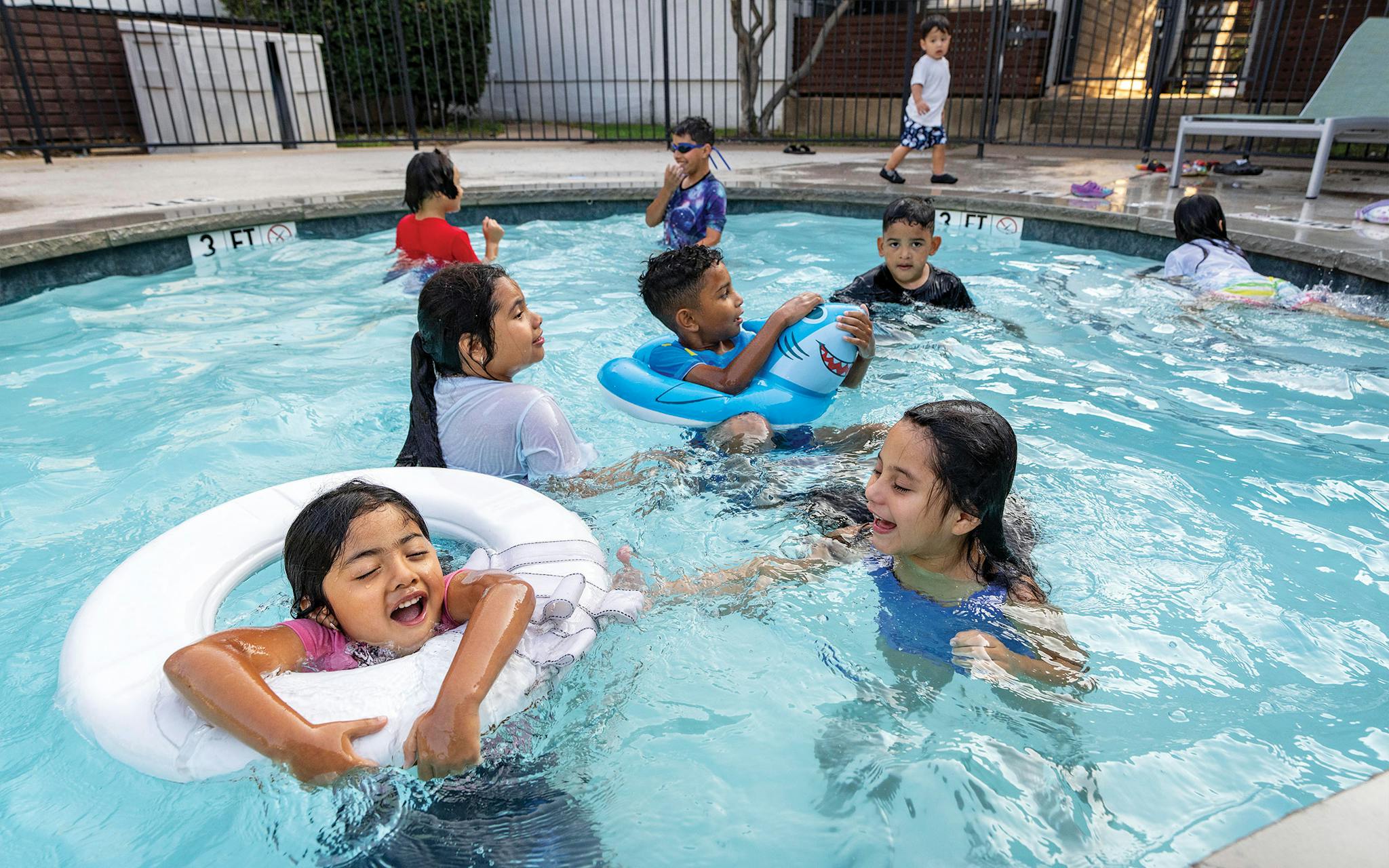 May 31 7:03 P.M. Five-year-old Daniella playing in the swimming pool at the far North Dallas apartment complex where she lives with her family. Her brother, Christopher, told me that he’d brought her to the pool to keep her spirits up after their mother was detained.
