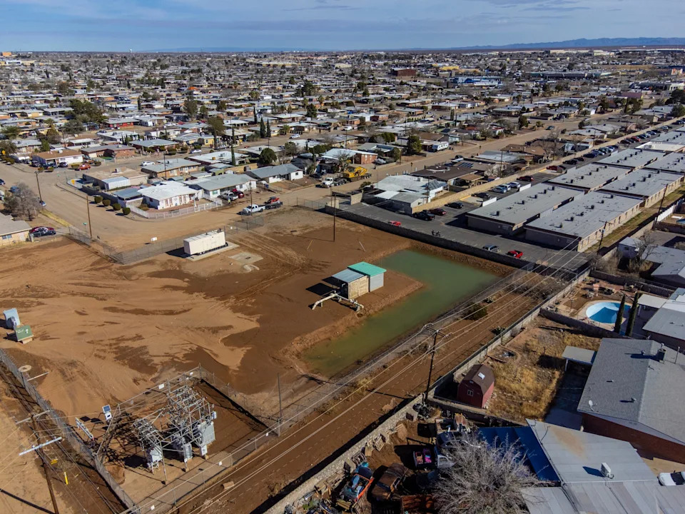Water and mud cover the ground at a water infrastructure station near Antonio Avenue in Northeast El Paso on Monday, Jan. 12, 2025, as seen from a drone after a water line break.