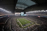  FILE - Fans watch at the start of an NFL football game inside AT&T Stadium between the New...