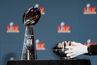 The Pete Rozelle MVP trophy and the Vince Lombardi trophy are placed before the start of a...