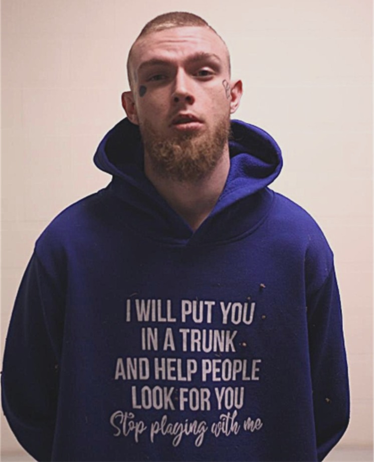 Kruz Dean Wanser was arrested in connection to a death in Texas wearing a shirt threatening to put someone in "a trunk," on Jan. 15, 2026.