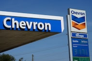 FILE - Chevron logos are displayed at a gas station in Columbus, Miss., Monday, Oct. 23,...