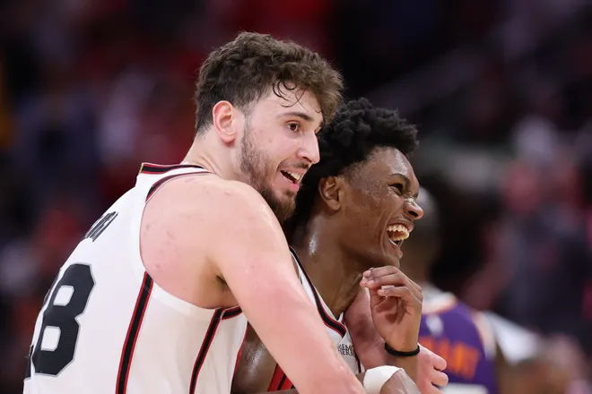 HOUSTON, TEXAS - FEBRUARY 12: Alperen Sengun #28 and Amen Thompson #1 of the Houston Rockets celebrate after a game against the Phoenix Suns during the second half at Toyota Center on February 12, 2025 in Houston, Texas. NOTE TO USER: User expressly acknowledges and agrees that, by downloading and or using this photograph, User is consenting to the terms and conditions of the Getty Images License Agreement. (Photo by Alex Slitz/Getty Images)
