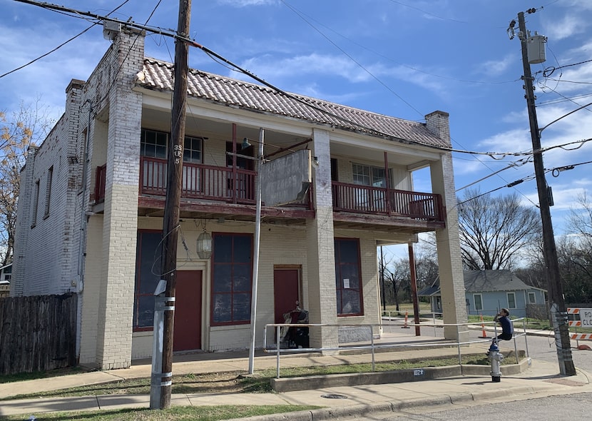 Linda Medina was sitting Monday in front of the old grocery and bar at the corner of 10th...