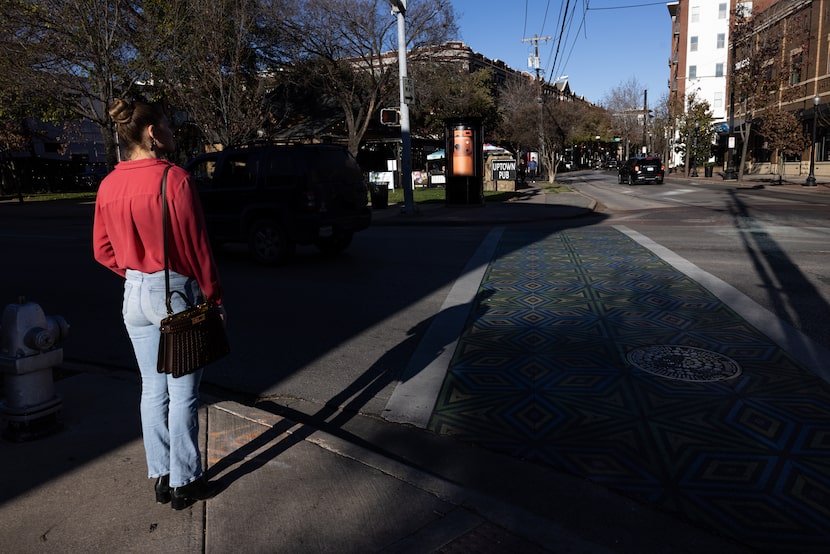 Sarah Nichol waits to cross a painted crosswalk at McKinney and Lemmon East avenues on...