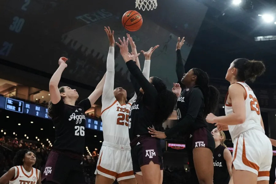 Texas forward Breya Cunningham (25) battles Texas A&M forward Anita Franchini (26) and guard Jordan Webster (6) for a rebound during the second half of an NCAA college basketball game in Austin, Texas, Sunday, Jan. 18, 2026. (AP Photo/Eric Gay)