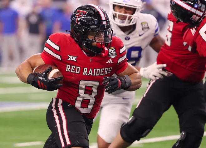 Texas Tech's Cameron Dickey runs for a touchdown against BYU during the Big 12 Conference championship game, Saturday, Nov. 6, 2025, at AT&T Stadium in Arlington.