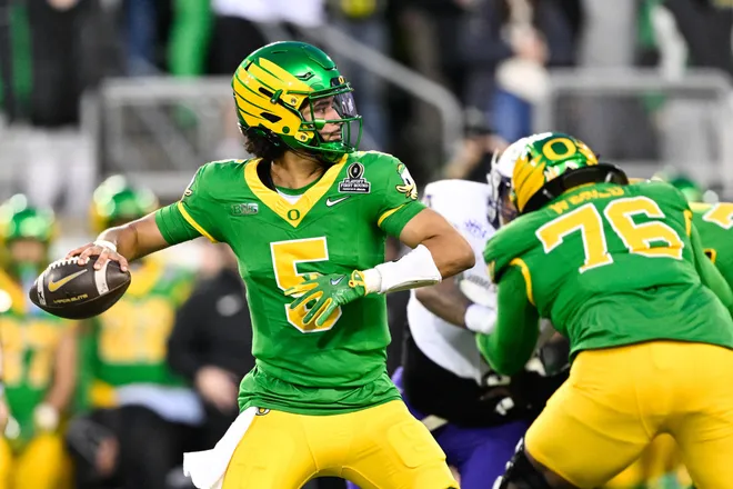 Dec 20, 2025; Eugene, OR, USA; Oregon Ducks quarterback Dante Moore (5) throws a pass during the first quarter against the James Madison Dukes at Autzen Stadium. Mandatory Credit: Troy Wayrynen-Imagn Images
