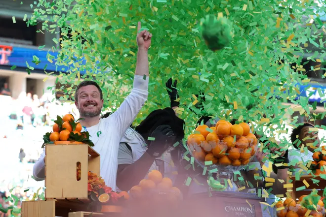 Jan 1, 2026; Miami Gardens, FL, USA; Oregon Ducks head coach Dan Lanning and players on the podium to receive the champions trophy following the 2025 Orange Bowl and quarterfinal game of the College Football Playoff against the Texas Tech Red Raiders at Hard Rock Stadium. Mandatory Credit: Sam Navarro-Imagn Images