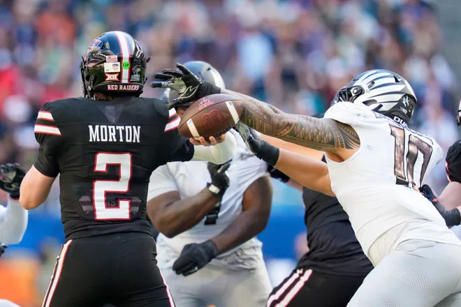Oregon outside linebacker Matayo Uiagalelei, right, strips the ball from Texas Tech quarterback Behren Morton as the Oregon Ducks take on the Texas Tech Red Raiders in the Orange Bowl on Jan. 1, 2026, at Hard Rock Stadium in Miami, Florida.